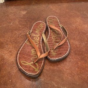 Brown leather flip flops